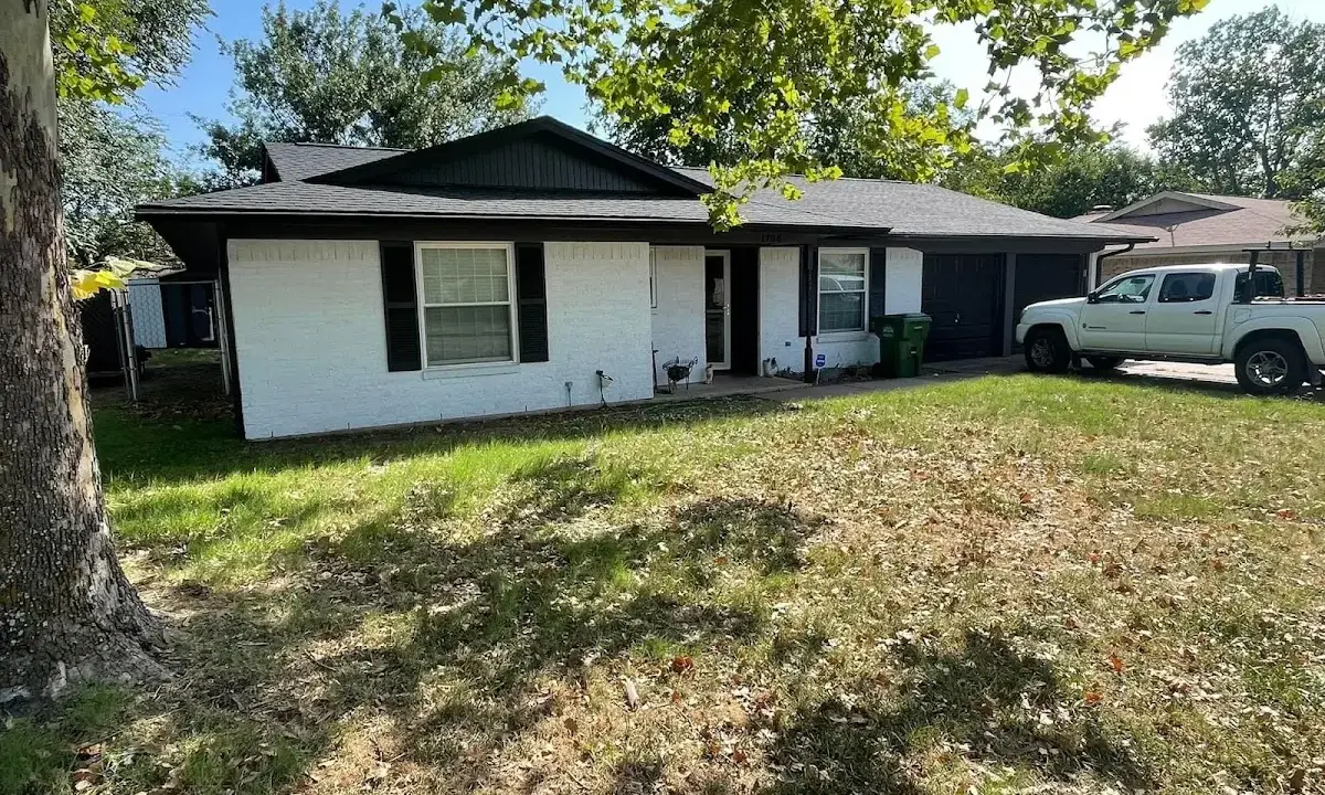Professional roofing crew working on a residential roof in Old Bridge